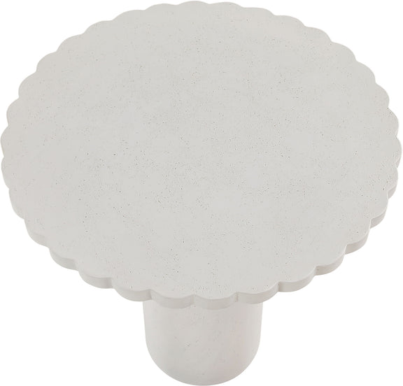 Light speckled round tabletop with scalloped edge and short pedestal base