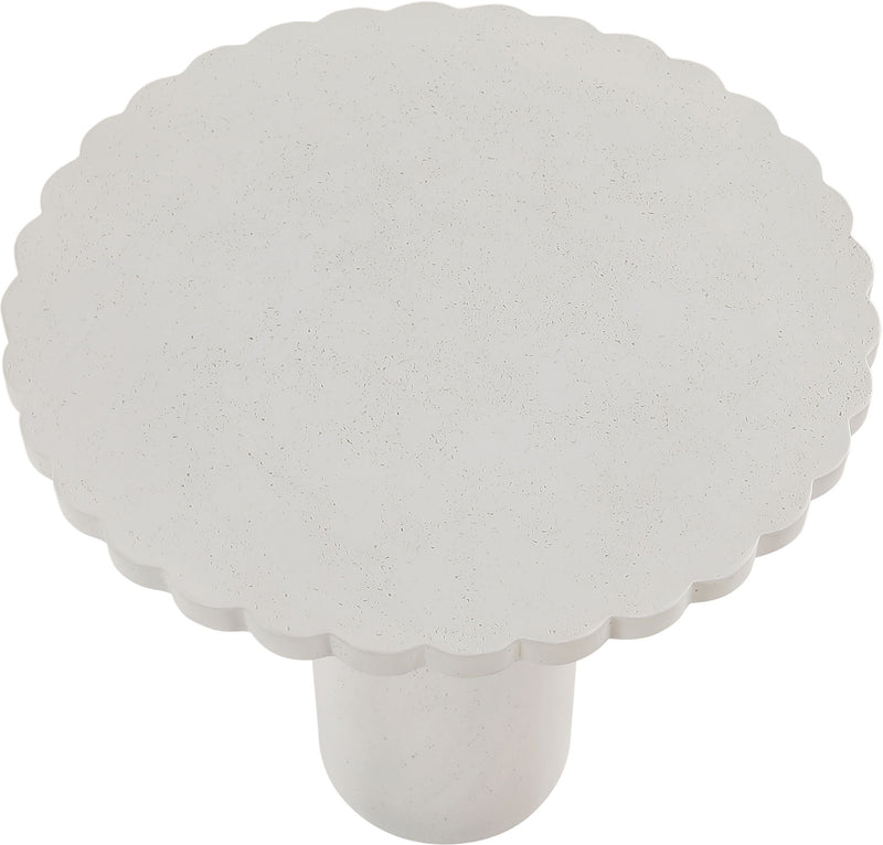 Light speckled round tabletop with scalloped edge and short pedestal base