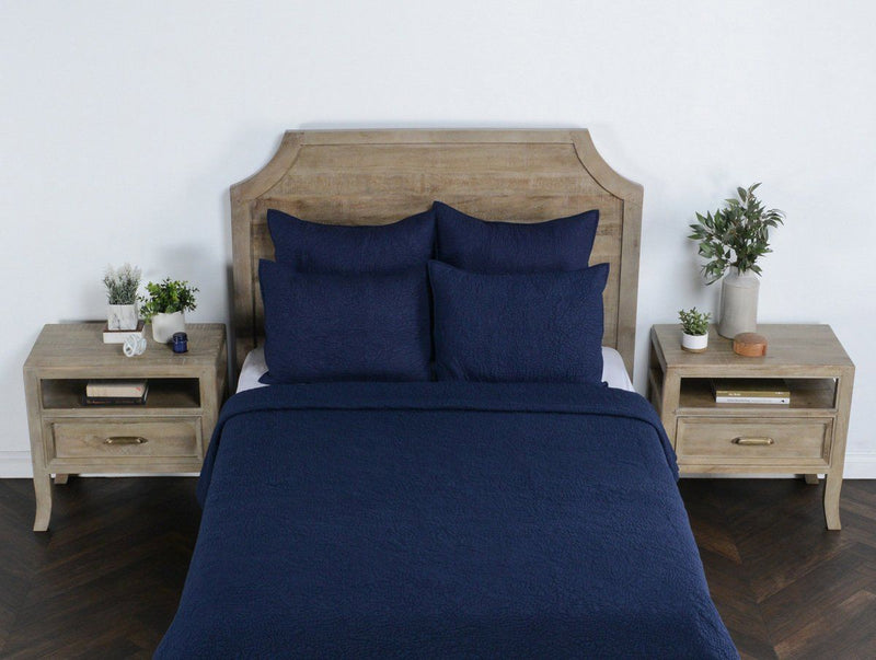 Indigo king sham set on bed with two matching pillow shams