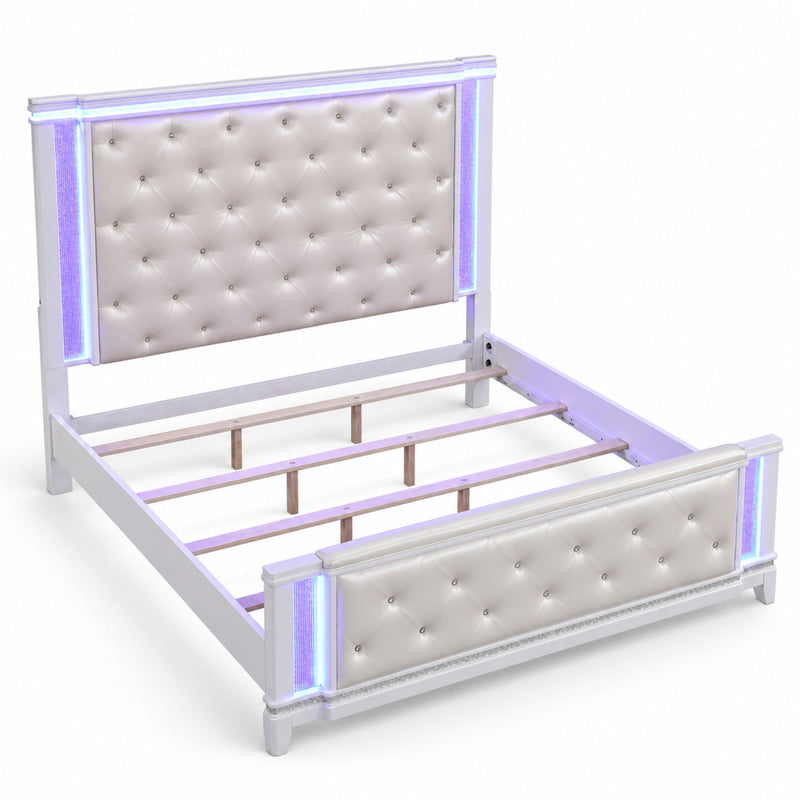 King-size tufted bed frame with white padded headboard and footboard.
