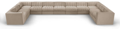 Beige modular sectional sofa with velvet-look upholstery and tufted cushions