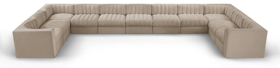Beige modular sectional sofa with velvet-look upholstery and tufted cushions