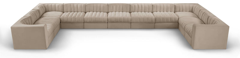 Beige modular sectional sofa with velvet-look upholstery and tufted cushions