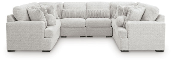 White plush sectional sofa with two corner ottomans and rounded arms