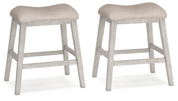 Set of 2 upholstered stools with light beige seats and weathered gray frames
