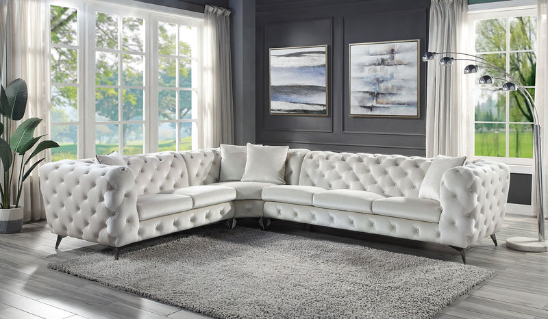 Beige tufted sectional sofa with 4 pillows, corner chaise and rolled arms