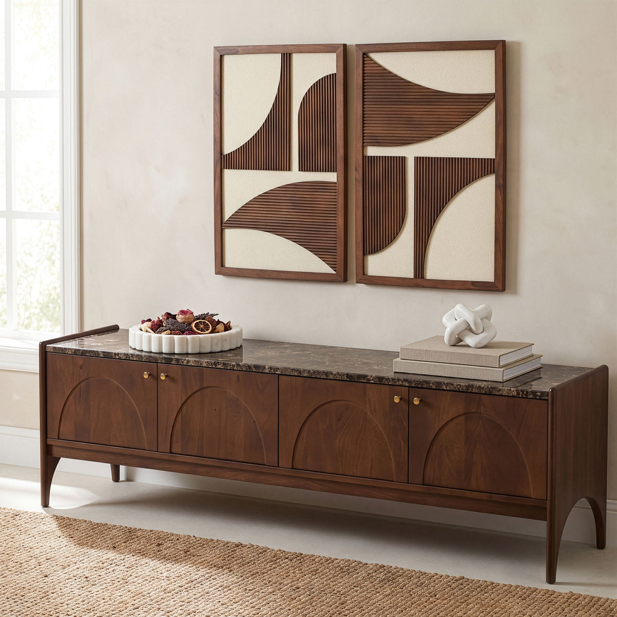 Mango wood media console with dark marble top, carved fronts, and brass knobs