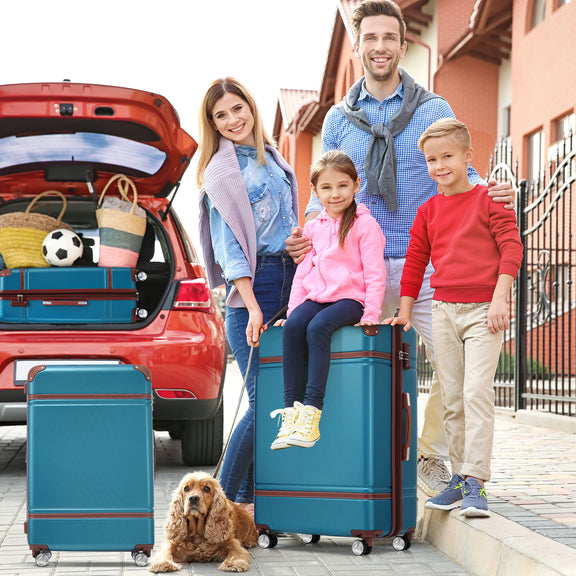 Teal hardshell spinner suitcase with retractable handle and four rolling wheels, plus small case.