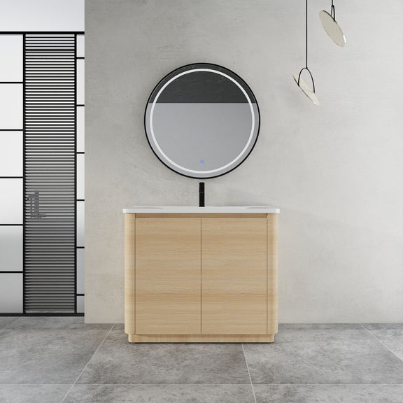 Freestanding bathroom vanity with white sink top and light brown two-door cabinet
