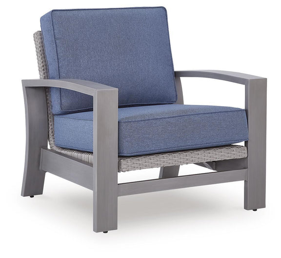 Blue cushioned lounge chair with gray arm frame and woven lower panel