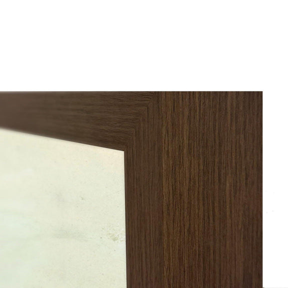 Brown wood frame edge corner with textured grain and white backing next to artwork