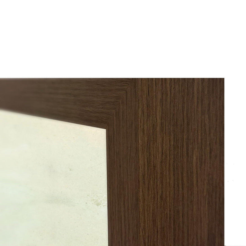 Brown wood frame edge corner with textured grain and white backing next to artwork