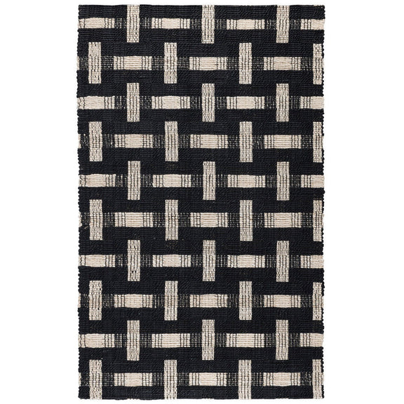 Preston rug with dark geometric lattice in black, white, and ivory