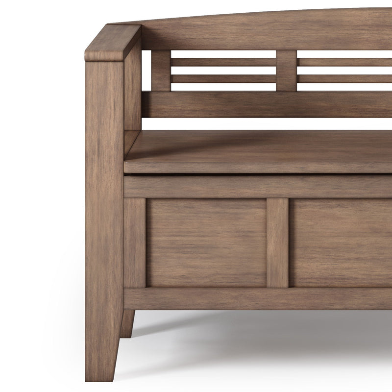 Wood storage bench with rectangular doors and open slatted back, rustic brown finish.