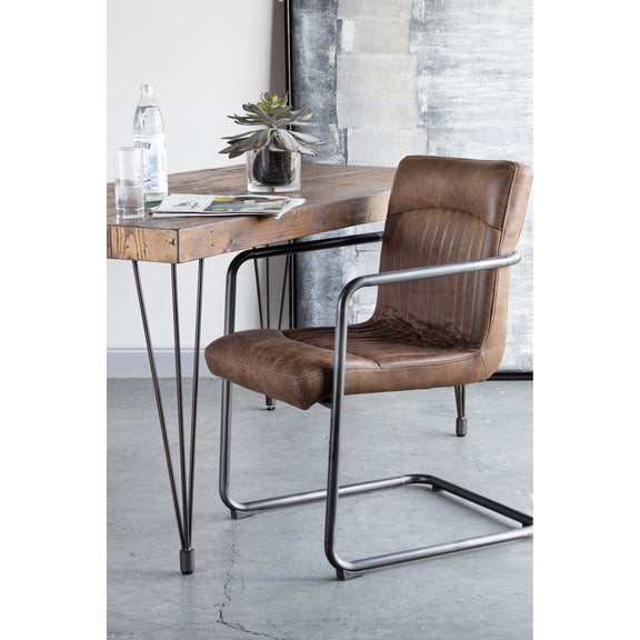 Brown leather arm chair with metal frame, cushioned seat and arms
