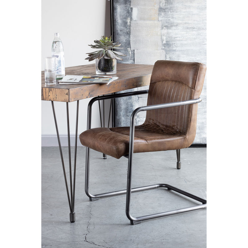 Brown leather arm chair with metal frame, cushioned seat and arms