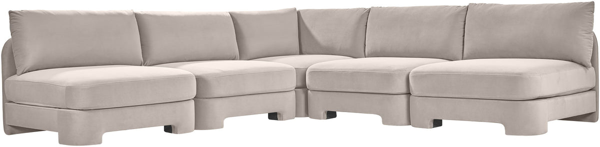 Light gray armless velvet sectional sofa with modular corner units and low profile.
