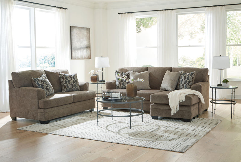 Living room sectional sofa set with chaise and ottoman-style seating, plus patterned pillows