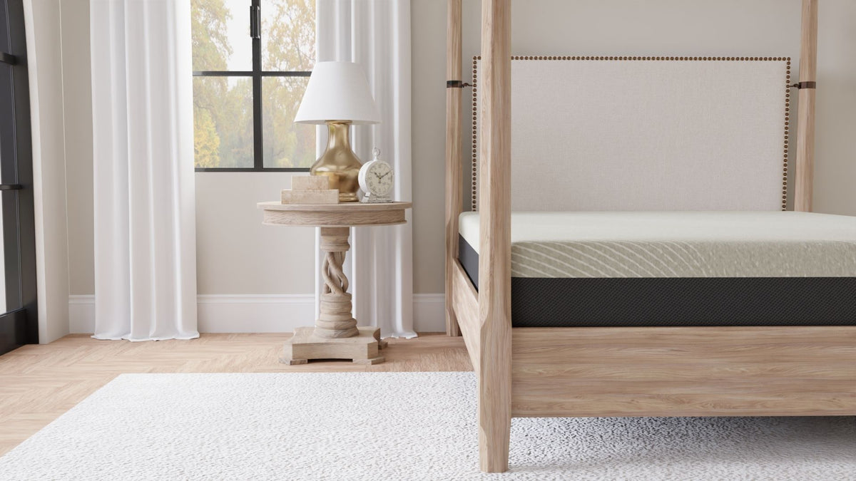 Gray tight-top gel memory foam mattress corner view on wood bed frame