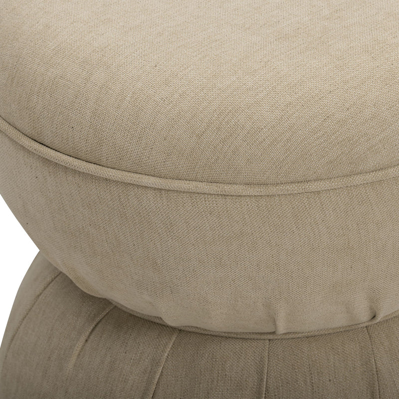 Close-up of beige ruched upholstered ottoman top with stitched seam