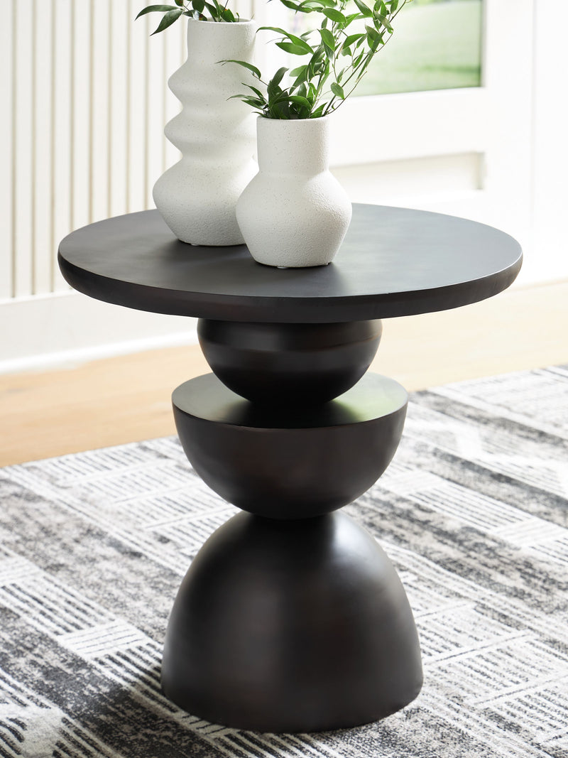 Bronze accent table with round top and sculpted pedestal base