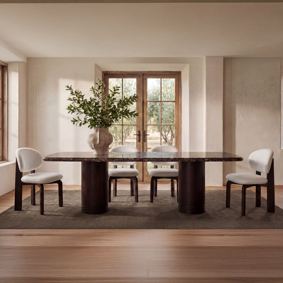 Two dining chairs with white upholstered seat and round back, dark wooden legs