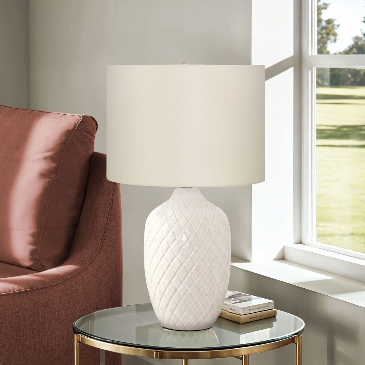 Cream table lamp with white drum shade and diamond-textured ceramic base on round top