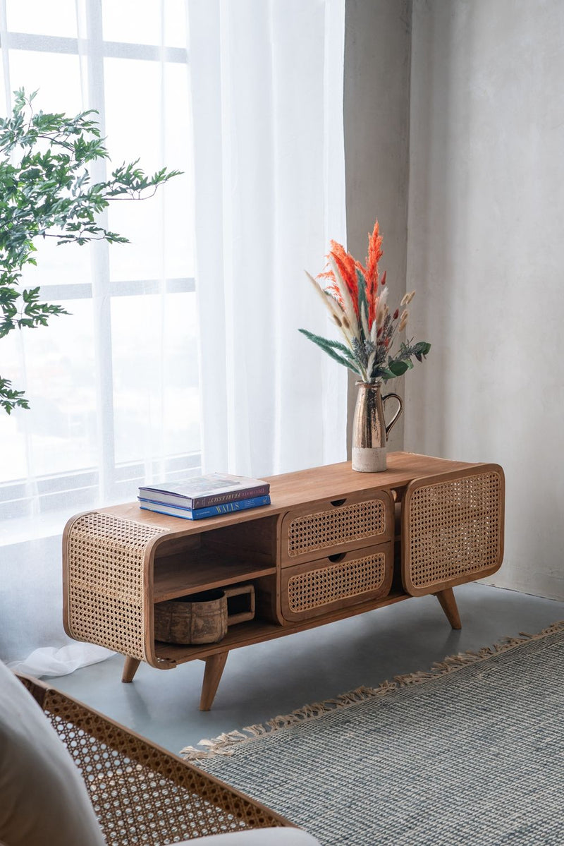 Teak cabinet with woven cane doors and drawers, open shelves, and tapered legs