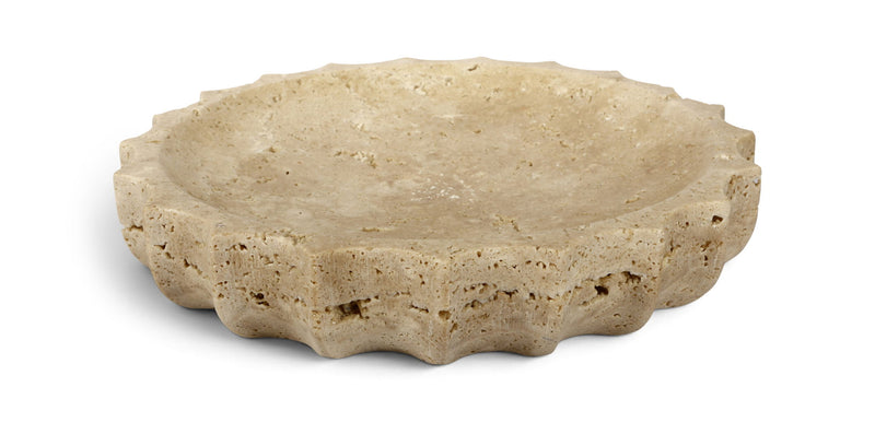 Beige travertine bowl with speckled texture and shallow curved rim.