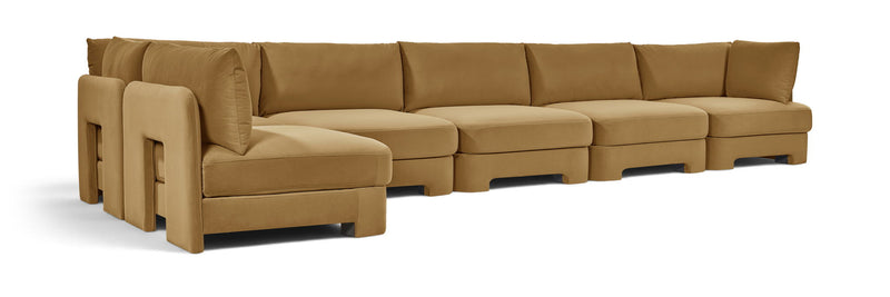 Tan L-shaped armless sectional sofa with velvet-style upholstery and padded back cushions