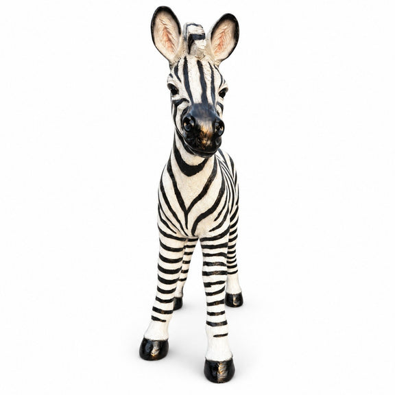Standing black and white zebra garden statue with upright ears and four legs
