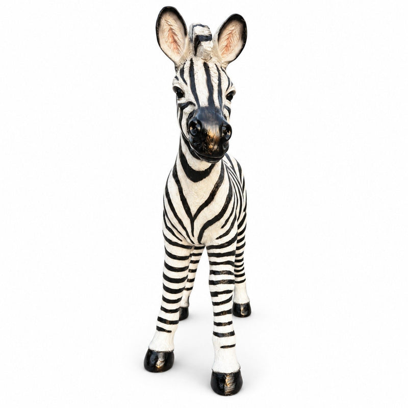 Standing black and white zebra garden statue with upright ears and four legs
