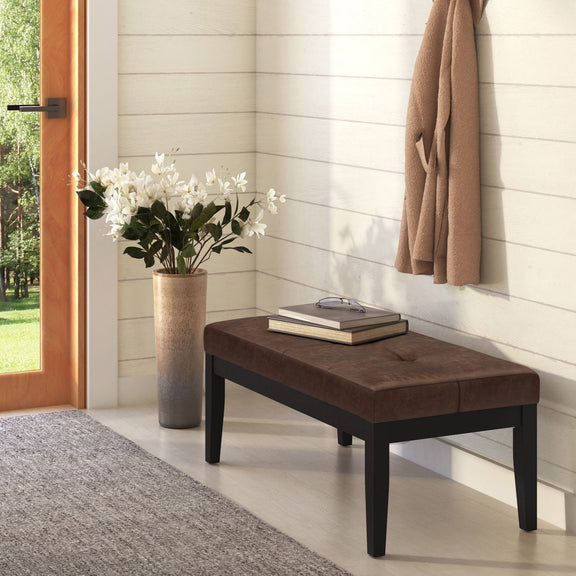 Lacey tufted ottoman bench in dark brown fabric with black tapered legs