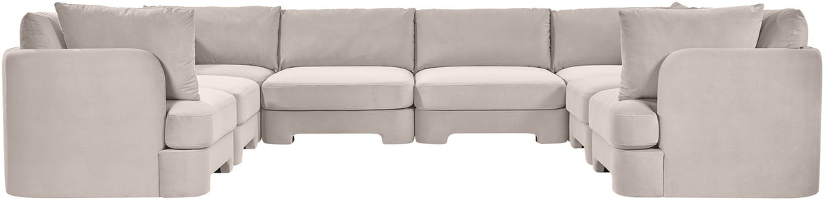 Light gray velvet performance sectional with deep seats, rounded arms, and U-shaped layout