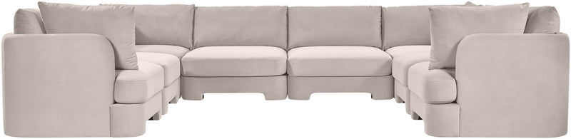 Light gray velvet performance sectional with deep seats, rounded arms, and U-shaped layout