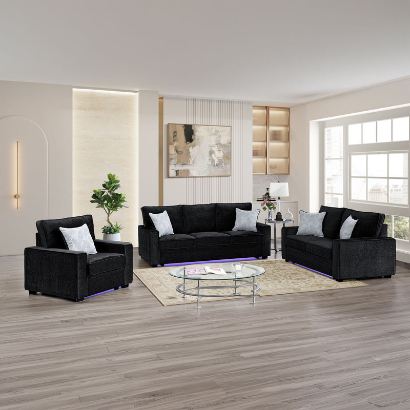Dark gray living room seating set with sofa, loveseat, and armchair; LED base light