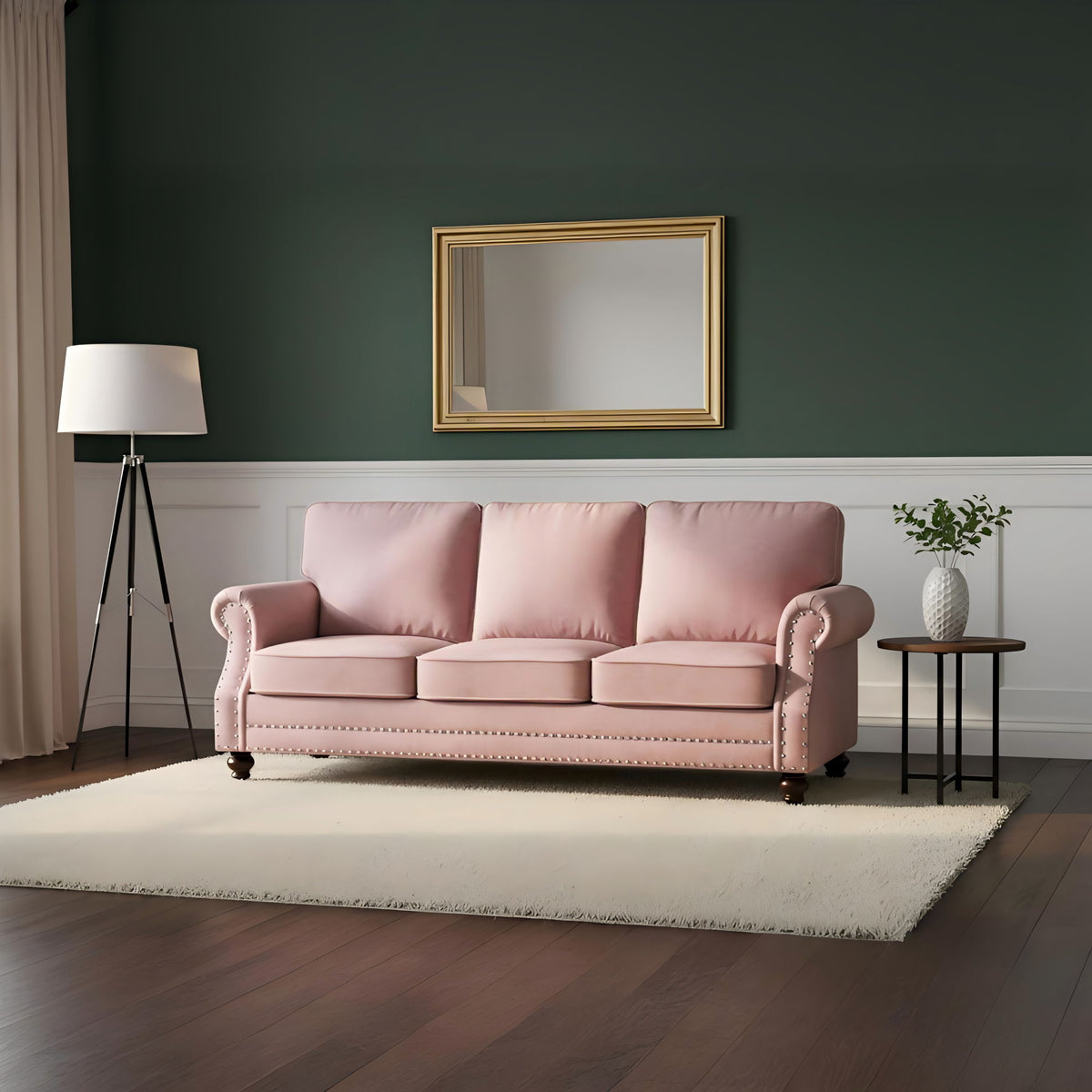 Pink 3-seat sofa with nailhead trim and turned legs, in living room setting