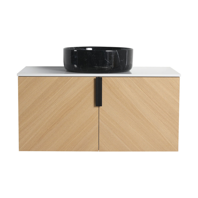 Wall-mounted bathroom vanity with light wood cabinet, white top, and black art sink