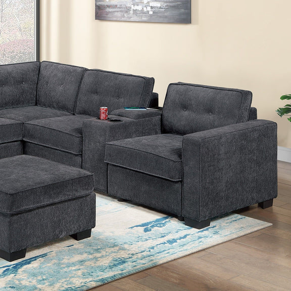 Dark gray sectional sofa with padded armrests, corner wedge seat, tufted cushions