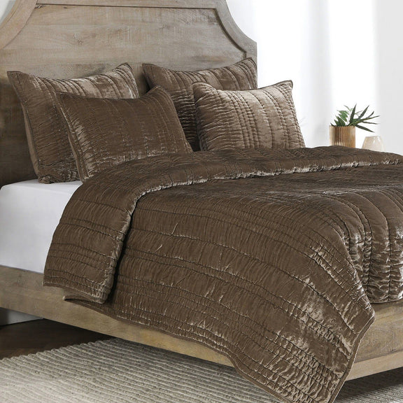 Taupe quilt set with layered, quilted edges and matching square throw pillows