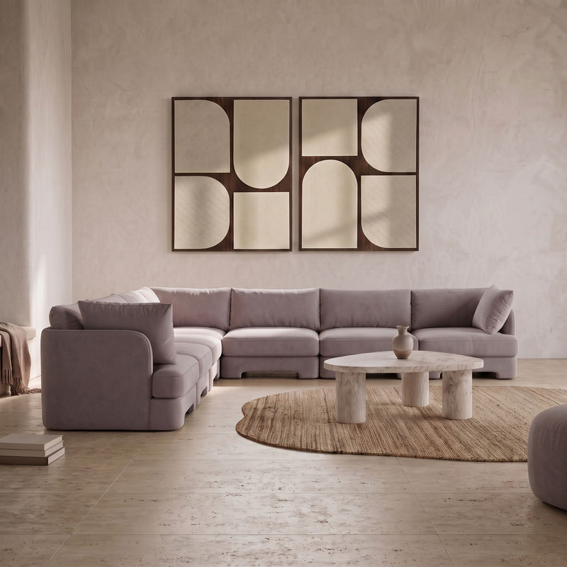 Gray velvet corner sectional sofa with tufted back and broad chaise-style seating