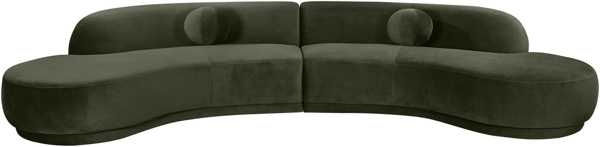 Dark green velvet sectional sofa with curved arms and plush cushions