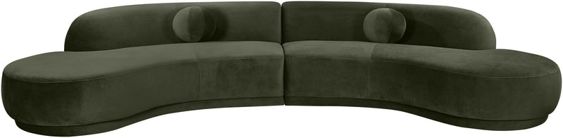 Dark green velvet sectional sofa with curved arms and plush cushions