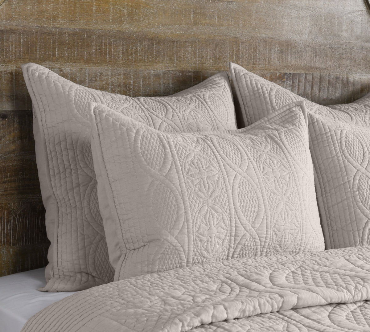 Anessa light taupe quilted pillow and folded throw