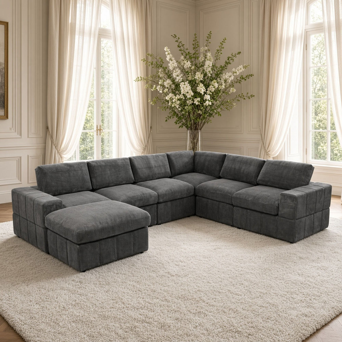 Dark gray sectional sofa with corner chaise and two matching ottomans, L-shape