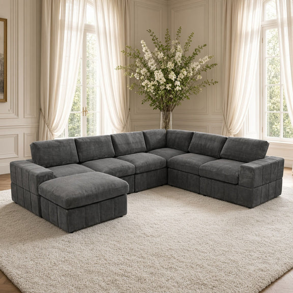 Dark gray sectional sofa with corner chaise and two matching ottomans, L-shape