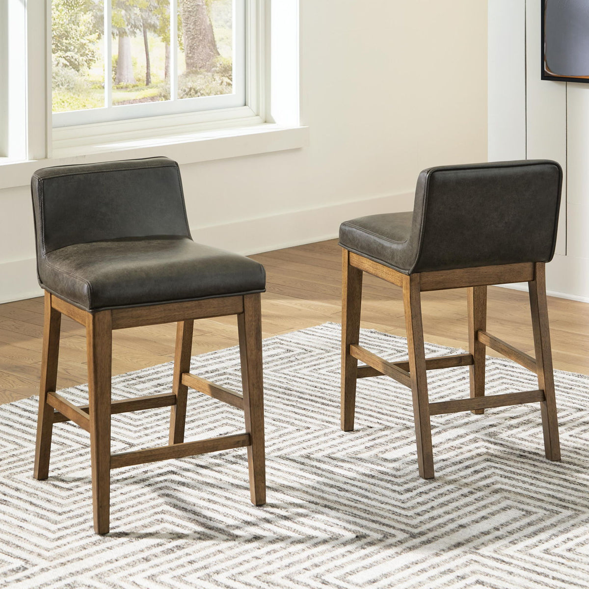 Two-tone brown upholstered barstool pair with dark seats on light wood legs