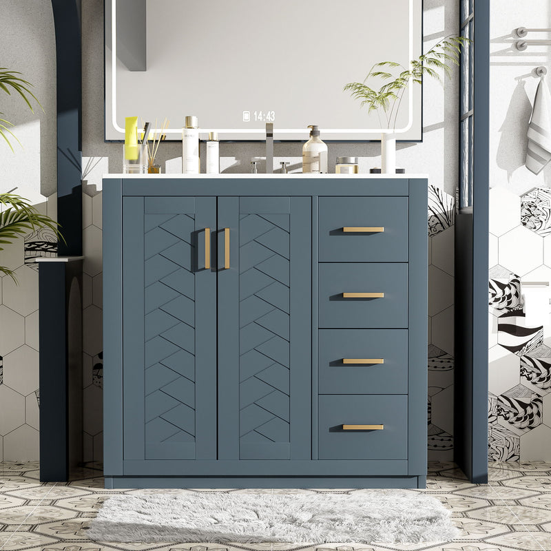 Blue bathroom vanity with two doors, three drawers, and gold bar pulls in a bathroom setup