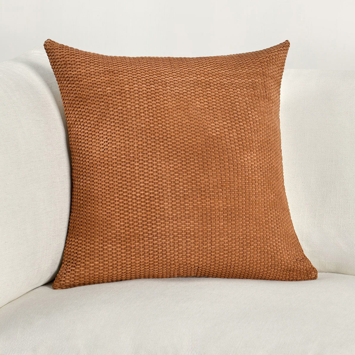 Square woven bassinet pillow in hazel, front view with visible stitching seams