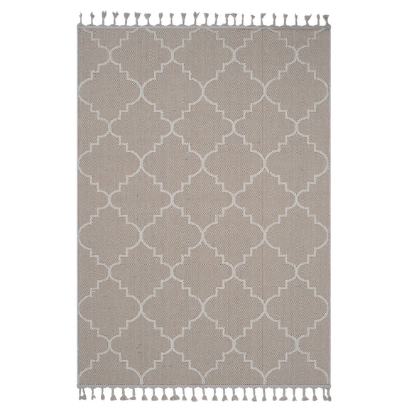 Taupe trellis area rug with white quatrefoil pattern and tassel fringe ends.